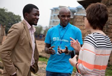 George Gachie, Kenya National UN Volunteer shares a moment with a local parliamentarian and UNV in Kibera slums, the community where he is leading a Participatory Slum Upgrading Project for UN-Habitat.