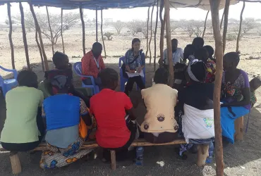 Akie Tanaka, UN Volunteer Associate Field Officer with UNHCR in Kakuma, camp, Kenya, during a focus group discussion in the community.