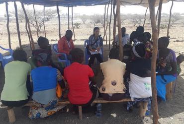 Akie Tanaka, UN Volunteer Associate Field Officer with UNHCR in Kakuma, camp, Kenya, during a focus group discussion in the community.