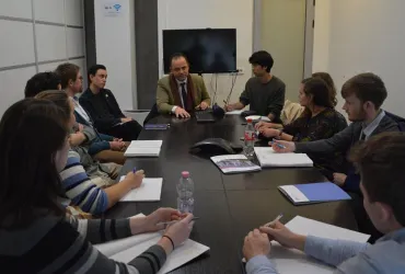 UNDCO colleagues Shpend Qamili (centre) and UN Youth Volunteer Anton Gille (left), with Minjoo Lee (UNDP, right) make a presentation on the work of the UN Kosovo Team to students of the European Master's Degree in Human Rights and Democratization.