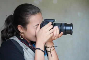 Alana Foley Pradhan, UN Volunteer Knowledge Management Officer captures photos, interviews, and dialogues in an interagency mission with UN Women in Liberia.