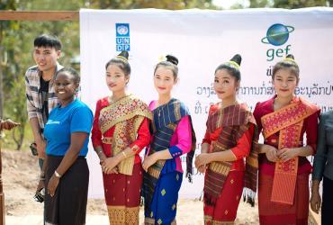 UN Volunteer, Monitoring and Evaluation Officer, Norah Ngeny (Kenya) poses with local Lao women at the ground breaking ceremony, in Ban Xanamsay Village, Lao PDR
