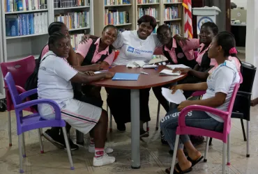 Ruth Cleopatra Engmann, UN Volunteer Liaison Officer assigned to the Resident Coordinator's Office, during a group discussion with school girls in Grand Bassa County, Liberia.