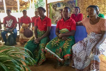 Local women join a community meeting organized by the International Organization of Migration in Madagascar.