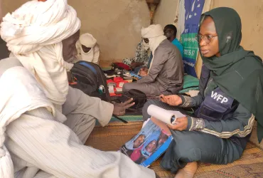 Volunteers support communities in accessing basic human services. Photo from Mali referenced in the 2026 SWVR.