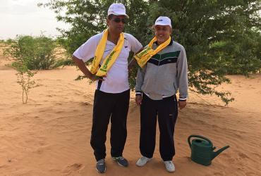 El Moctar Mohamed Yahya (right) is a national UN Volunteer Resource Mobilization Expert. He is seen with the representative of the town of Mederdra, during a tree-planting initiative to combat desertification in Mauritania.