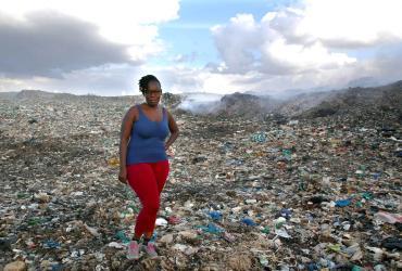 Mercy Ochieng Odhiambo, national UN Volunteer Community Specialist with UN-Habitat, at a dumpsite in Nairobi to meet with waste pickers and hear about their challenges. 