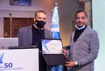 Tunisian volunteer Mohamed Guediri (right) receiving an award for inspiring new forms of volunteering through innovation.