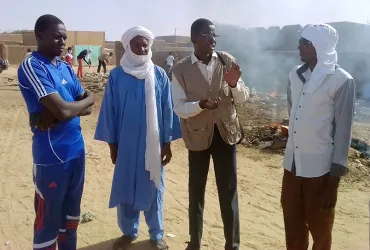 National UN Volunteer Hassane Abdoulsalamou with youth engaged in the project.