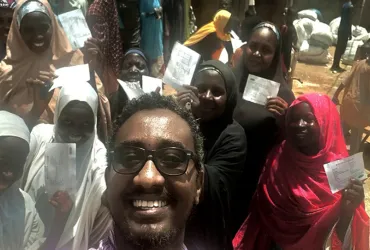 UN Volunteer Tiruneh Debena after validation of the beneficiary targeting and monitoring the distribution of food inputs to conflict-affected communities in Yola, Adamawa State, North-East Nigeria.