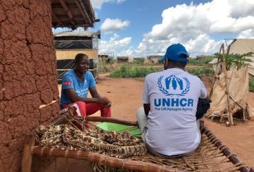 UNHCR staff assessing the strengths and needs of an internally-displaced person regarding livelihood and income generation opportunities at Corrane IDP site, Nampula District. 