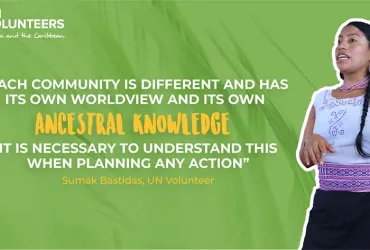 Former national UN Volunteer Sumak Bastidas leading an awareness activity through open talks with the community assembly.