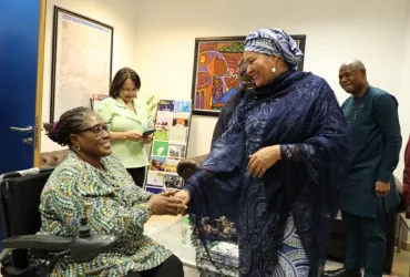Ekaete Judith Umoh, UN Volunteer, greets UN Deputy Secretary-General, Amina Mohammed, at the UN House in Nigeria.