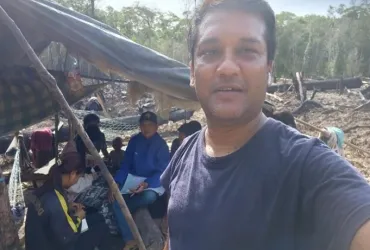 Sanjeev Roy, UN Volunteer Provincial Malaria Officer with WHO reaches out to the local population in remote forest areas.