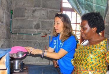 UN Volunteer Serena testing a biogaz installation in the framework of the ‘safe access to fuel and energy’ approach to reduce environmental impact of cooking needs through the production and use of durable clean energy. Credits UNH