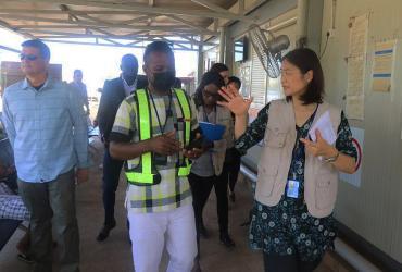 Kyoko Yokosuka (right), UNV Deputy Executive Coordinator, interacting with the UNMISS Movement Control Section team, who support planning and management of movement, freight and cargo. 