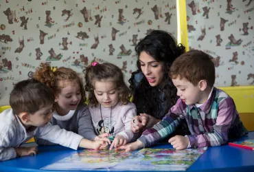 Rana Awad, national UN Youth Volunteer with UNICEF in an activity with kindergarten children, State of Palestine.
