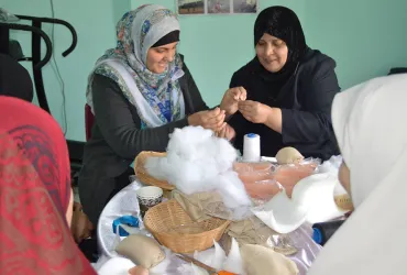 Shahd El-Swerki (left), national UN Volunteer Communications Assistant at UNDP Gaza, visited a cancer care centre and joined women volunteers in sewing breast prosthetics, which are distributed for free to female cancer patients.