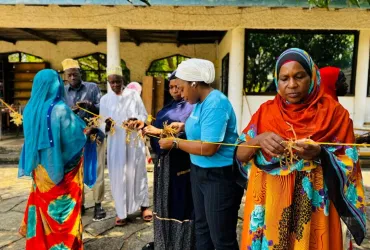 A national UN Volunteer with UNDP in Tanzania, Rahma Ally Juma, mobilizes coastal communities for the Bahari Maisha project and supports sustainable aquaculture—sea cucumber, sea moss, and crab farming—to improve the livelihoods of women and youth.