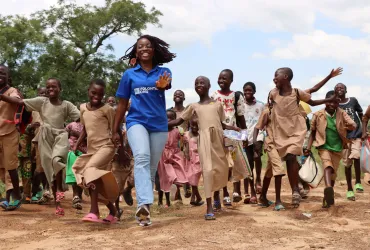 Volunteers support programme monitoring to enhance results for children in Togo. Photo referenced in 2026 SWVR.