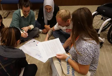 UN Volunteer Inclusion and Disability Officer Aliaksandr (Sasha) Avdevich (second from right) serves with the United Nations Development Programme (UNDP) in his home country of Belarus. Here, he participates in a team exercise during assignment preparation training held in Istanbul, Turkey.