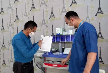 National UN Volunteer Emergency Nurse Ahmed Al Rough (left), checking a list of critical emergency medications at UN clinic in Sana'a, Yemen.