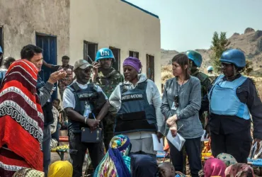 UN Volunteer William Joof (second left), facilitating a UN Sanctions Committee’s security assessment visit to Sudan Liberation Movement/Army (SLA) controlled Dorsa, Central Darfur.