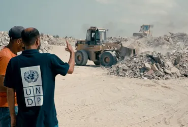 UN Volunteer Field Engineers Hussein AlWasifi (left) and Mohammed Alghouti (right) during on-site debris removal in Gaza.