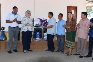 UNDP Resident Representative, Ricarda Rieger handing over early warning communication equipment to the Vice Governor of Attapue Province along with Victor Igbokwe, UNV Disaster Risk Management Specialist working with UNDP (May 2019).