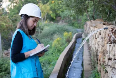 Raymonda Chamoun, national UN Volunteer Specialist Water/Irrigation Engineer with UNDP Lebanon monitors the implementation of irrigation canal rehabilitation project in Sir El-Denniyeh, north Lebanon.