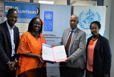 UNV Country Coordinator Moses Mubiru (left) at the signing of a secondment agreement for UN Volunteers to support the Ebola response. Next to him are UNDP Resident Representative Ms Elsie Attafua, WHO Representative Dr Yonas Tegegn Woldemariam and UNDP Deputy Representative Ms Sheila Ngatia (from left to right).