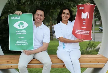 National UN Volunteer Jasurjon Ibragimov (second from left) with former UN Volunteers Seohyeon Yang (left), Hyojin Lee (second from right) and Makhbuba Khamraeva (far right). ©UNDP, 2019