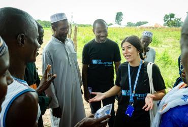Volunteers' support at the local level is crucial. Here, UN Volunteers, Innocent Mugisha Muturambirwa and Maria Eleonora Ferrorelli meet local communities in Guinea-Bissau to speak about challenges such as access to water, healthcare, and justice in remote areas.
