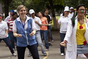 UNV Associate Protection Officer Alba Marcellán (left) during an activity at the Don Bosco school in Caracas on World Refugee Day 2012 organized by UNHCR, Caritas and HIAS.