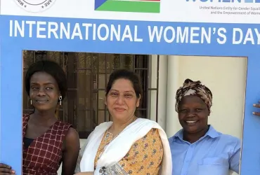 Shukria Syed, UN Volunteer with UN Women, poses with women from South Sudan during International Women's Day event