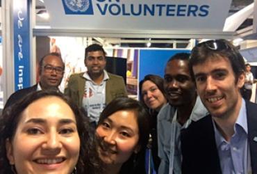 UN Volunteer Sheriff Abdulai (second from right), with other UN Volunteers and UNV staff, at the UNV booth at the World Humanitarian Summit that took place in Turkey in May 2016. 
