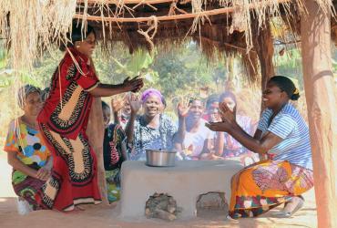 Women in Matebo Village in Kalumbila District, Zambia, try out their new energy-saving stoves .