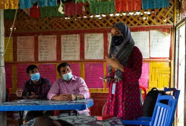 Sabrina Sharmin, UN Volunteer Information Management Officer with UNICEF provides training on data collection to the implementing partners in the learning center in Rohingya camps
