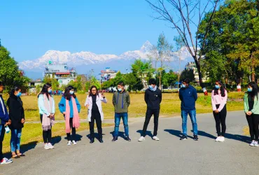 Binita Karki, UN Volunteer Youth Programme Officer with UNDP Nepal (5th from left) interacts with university students on climate mitigation