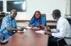 Christelle Fanny-Ange Matchum (center) international UN Volunteer External Relations and Partnerships Communication Officer with WHO in Togo brainstorms with her colleagues on partnerships strategy.