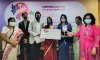 Winner of the Inspiring Women Volunteer Award 2021 in Bangladesh, Ms Tahiatul Jannat (centre), receiving the award. 