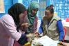 UN Volunteer Sitara Khatiwada (right) during a capacity building session at a Rohingya Refugee Camp in Cox’s Bazar, Bangladesh