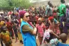 UN Volunteer Associate Field Protection Officer with UNHCR, Bouchra Makhlouf, with refugees from the Central African Republic in Goré refugee camp, Chad.