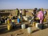 Sudanese refugee women prepare to fill their containers with precious water at a camp in eastern Chad.  