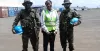 Aya Alice Kouakou (Côte d'Ivore) UN Volunteer Air Operations Assistant, with UN peacekeepers on the tarmac of Bukavu, Democratic Republic of Congo.