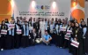 Toily Kurbanov, Executive Coordinator of UNV (front center), with UN Volunteers at the Second World Summit for Social Development in Doha. 