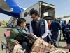 Ahmed Anas Awad, UN Volunteer, speaks to Palestinian patient being medically evacuated to Greece through the EU Civil Protection Mechanism.
