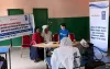 Japanese national, Emi Leung, UN Volunteer Governance Officer with UNDP in The Gambia, engages with communities on the Joint United Nations Programme on HIV/AIDS.