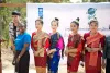 UN Volunteer, Monitoring and Evaluation Officer, Norah Ngeny (Kenya) poses with local Lao women at the ground breaking ceremony, in Ban Xanamsay Village, Lao PDR
