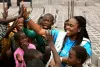 Angelique Gatsinzi, international UN Volunteer with UNICEF, with street children in Kinshasa's 25th district. Through its programmes, UNICEF empowers street leaders and bolsters the social work approach, serving as a vital bridge between social services and vulnerable children.
